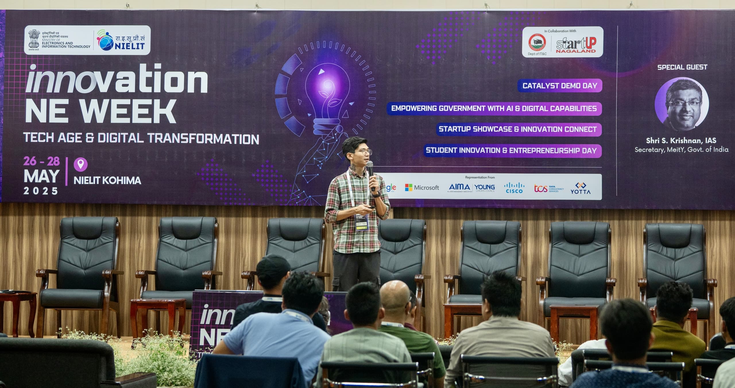 Shivam Selam presenting on stage at Northeast Innovation Week, NIELIT Kohima